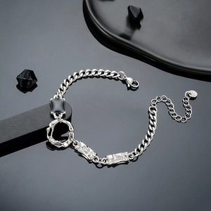 Silver cuban link bracelet for men with zircon accents and black enamel on black background