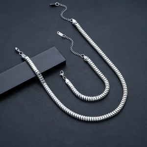 Detailed view of silver stainless steel fish scale chain necklace and bracelet set