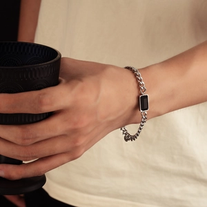 Men's titanium steel bracelet with rectangular black inlay on a flat cuban link chain