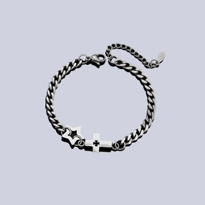 Men's silver cross and star curb chain bracelet with industrial punk aesthetic