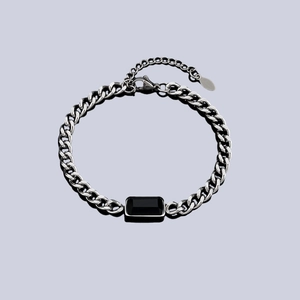 Minimalist titanium steel chain bracelet with black rectangular center on mirror base