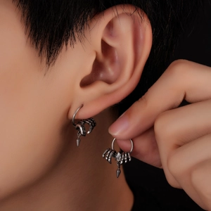 Gothic silver skeletal claw earrings with clear gemstone and spike pendant