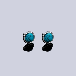 Minimalist round turquoise stud earrings with silver metal frame and natural veins