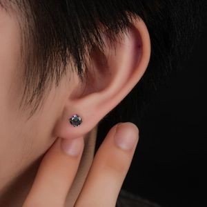 Macro shot of titanium internal thread stud earring with colorful crystal in 4-prong setting