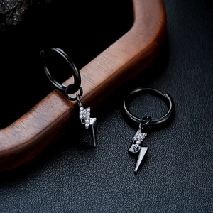 Macro view of black lightning bolt hoop earring with white cubic zirconia inlay