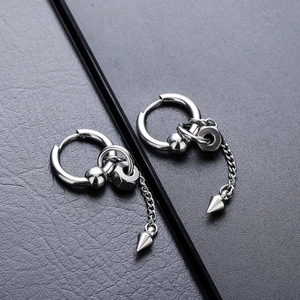 Detail of silver titanium drop earrings with industrial cone, chain and nut elements