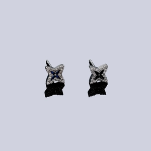 Cross-star stud earrings with pavé diamonds and blue and black center stones
