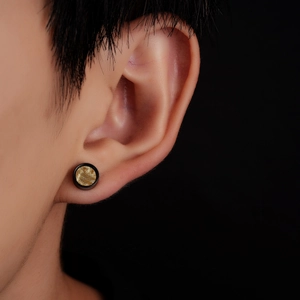 Unisex titanium steel stud earrings with golden textured center and black border