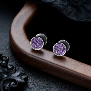 Polished silver stainless steel stud earrings with purple textured inlay on dark wood