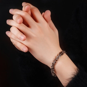 Retro silver steel bracelet with classic cross floral engraving for men worn on wrist