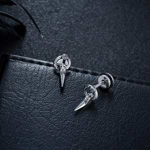 Gothic style silver titanium steel wolf fang stud earrings with cone pendants on black leather