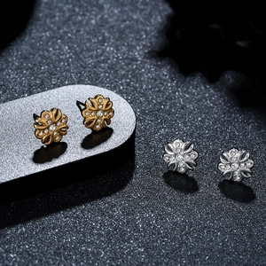 Polished iris cross stud earrings in gold and silver steel with white zircon stones