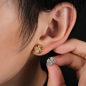 Fleur-de-lis cross stud earrings in gold and silver steel with cubic zirconia