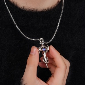 Titanium steel chain necklace featuring a dragon coiled around a sword with blue gem