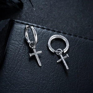 Vintage stainless steel hoop earrings with textured cross pendants on black leather