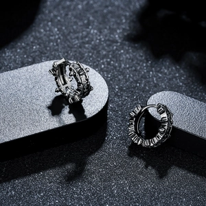 Retro titanium steel hoop earrings with spiked texture and vintage silver finish