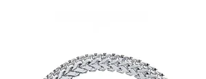 Macro shot of silver polished wheat link chain bracelet with detailed braided texture
