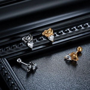 Detail of titanium steel cat heart earrings with zircon and screw ball backings