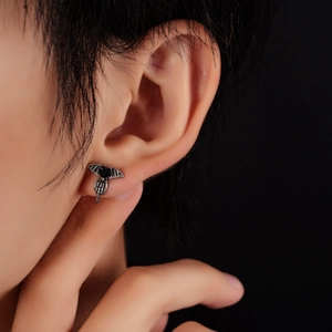 Gothic bat wing ear stud with black heart stone detail in vintage silver finish