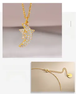Macro view of gold S925 silver star and moon pendant with adjustable lobster clasp chain