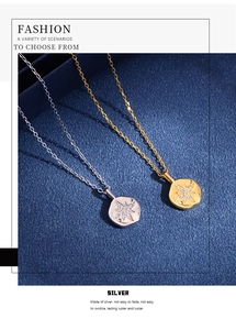 Macro detail of silver and gold irregular star pendant necklaces with zircon inlay