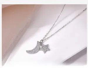 Detail of S925 silver moon and star pendant necklace set with pavé cubic zirconia
