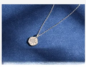 Detail of S925 sterling silver star pendant necklace with sparkling crystal inlay