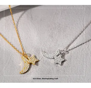 Macro shot of silver and gold S925 moon and star necklaces with sparkling white zircon