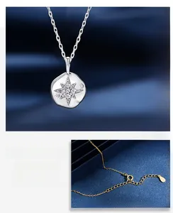 Macro detail of S925 silver star pendant and adjustable gold chain with lobster clasp