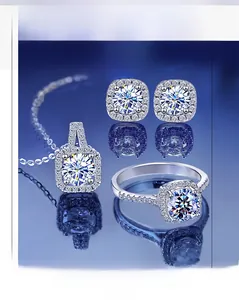 Macro detail of silver moissanite halo jewelry set with ring, earrings and necklace