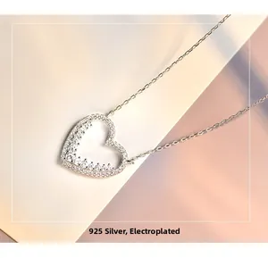 Macro shot of S925 sterling silver heart pendant with shimmering zircon pavé setting