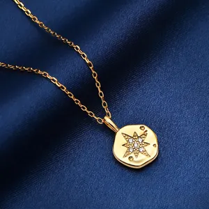 Gold S925 sterling silver necklace with sparkling star pendant on blue silk