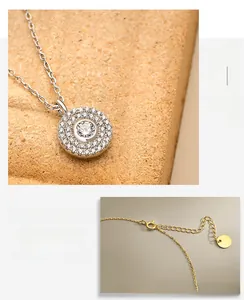 Detail of S925 sterling silver pave disk pendant and adjustable lobster clasp extension chain