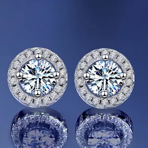 Sparkling S925 sterling silver halo moissanite stud earrings on a deep blue background