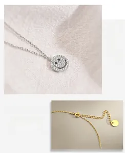 Detail of S925 silver smiley face necklace with lobster clasp and adjustable tail chain