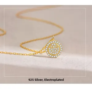 Macro shot of gold-plated 925 sterling silver smiley necklace with pavé-set zircons