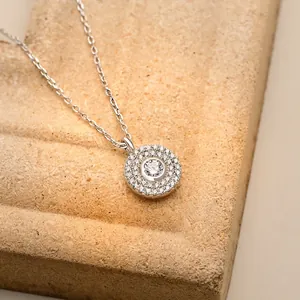 Sparkling S925 sterling silver halo necklace with round pavé crystals on textured stone