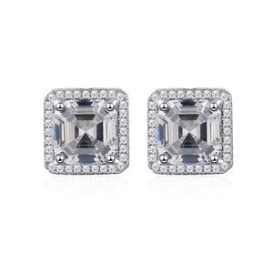 Close-up of square halo silver earrings featuring step-cut center stones and pave stones