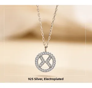 Close-up of S925 sterling silver necklace with X-shaped pendant and pavé set zircons