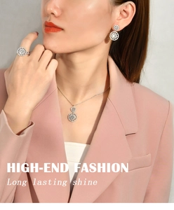 Model wearing S925 sterling silver snowflake necklace, earrings and ring set