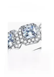Macro shot of micro-pave setting and cushion cut zircon on the square silver ring band