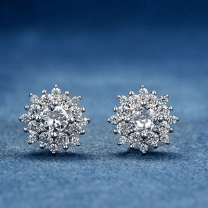 Sparkling S925 sterling silver snowflake stud earrings on dark blue velvet