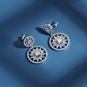 Elegant S925 sterling silver snowflake earrings with zirconia floral cutout pendants