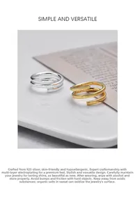 Detail of silver and gold layered wrap rings in S925 sterling silver with a polished finish