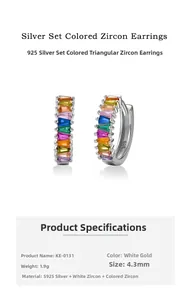 Macro shot of S925 sterling silver huggie earrings with rainbow baguette-cut zircons