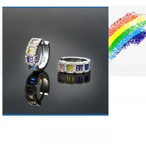 Detail of 925 sterling silver hoop earrings featuring colorful square-cut cubic zirconia stones