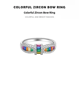 Macro detail of S925 silver bow ring with rainbow baguette-cut colorful zircons
