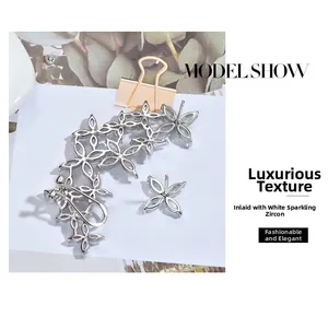 Detailed view of silver snowflake earrings featuring brilliant white cubic zirconia
