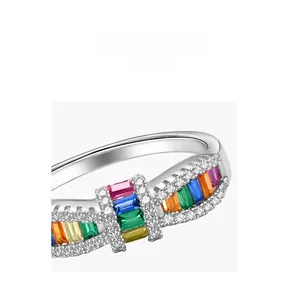 Macro detail of S925 silver ring featuring baguette-cut colored stones and pavé diamonds