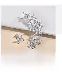 Macro detail of S925 sterling silver butterfly ear cuff set with sparkling zircon stones